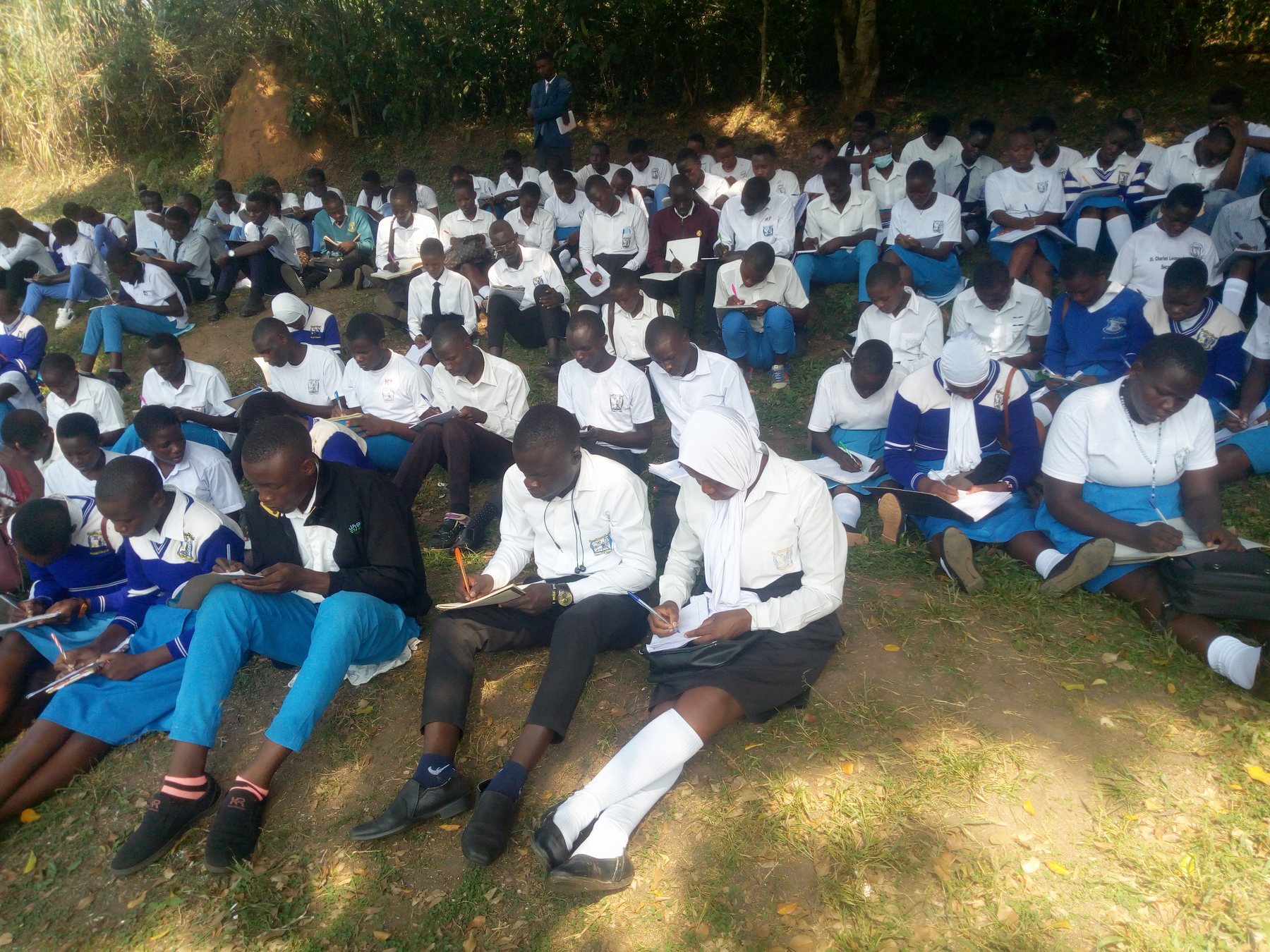 Learners gathered outdoors